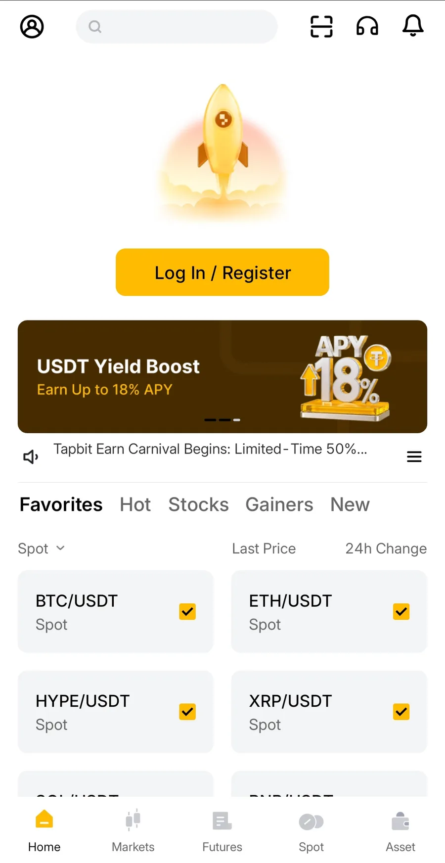 탭비트 가입 2단계 — 로켓 그림 아래 노란 Log In / Register 버튼과 USDT Yield Boost 배너가 있는 영어 홈 화면